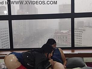 Kitty with big ass fucks boldly in window for public view