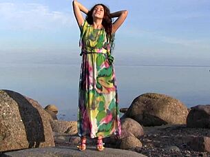 norma a masturbates sensually on the beach