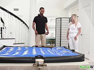 blonde masseuse delivers wet nuru massage.