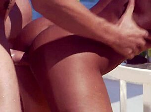 Dee massages and fucks by the pool in hot outdoor interracial scene!