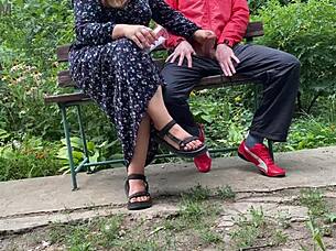 I can't believe this hot milf jerked off a big dick into a glass on the park bench