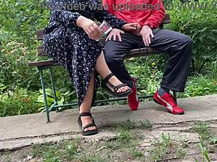 I can't believe this hot milf jerked off a big dick into a glass on the park bench