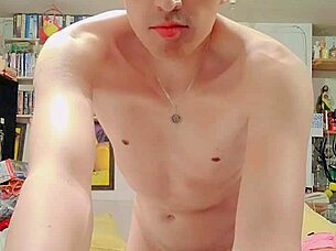 skinny guy masturbates big cock in living room.