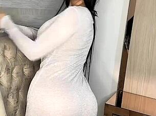 This latina babe plays with her huge dildo