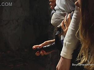 Look at this submissive lesbian slave bent over and tied up, orgasming from strapon domination