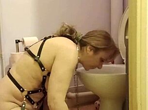 feeling like a whore, bent over in bondage, licking the toilet
