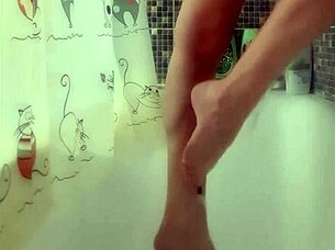 Busty teen washes her perfect feet in the shower