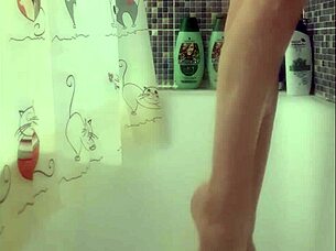 Busty teen washes her perfect feet in the shower