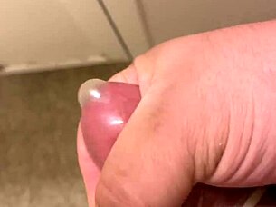 Watch me masturbating with a condom on my cock