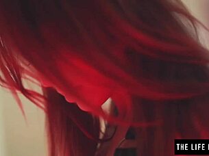 Pretty redhead ties herself up in leather corset and whips her ass with bondage toys until she reaches orgasm.