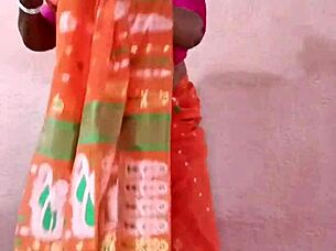 Curvy Indian beauty in traditional saree poses elegantly showcasing her natural charm.