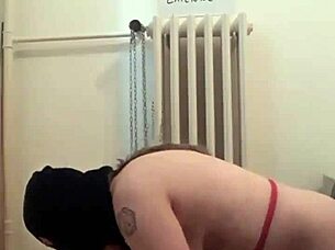 Slave bound in handcuffs gets spanked and pissed on outdoors