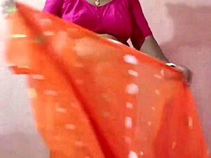 Curvy Indian beauty in traditional saree poses elegantly showcasing her natural charm.