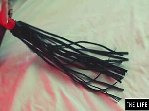 Pretty redhead ties herself up in leather corset and whips her ass with bondage toys until she reaches orgasm.