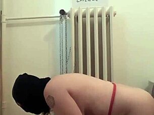 Slave bound in handcuffs gets spanked and pissed on outdoors