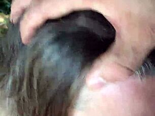 Slave bound in handcuffs gets spanked and pissed on outdoors