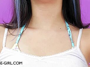 Petite teen model gently caresses her body during solo photoshoot session