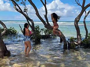 Two beautiful Brazilian women enjoy their first time kissing and exploring on the sunny beach. Their curvy bodies shine under the sun in this outdoor adventure.
