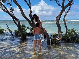Two beautiful Brazilian women enjoy their first time kissing and exploring on the sunny beach. Their curvy bodies shine under the sun in this outdoor adventure.