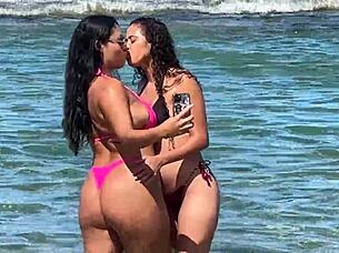 Two beautiful Brazilian women enjoy their first time kissing and exploring on the sunny beach. Their curvy bodies shine under the sun in this outdoor adventure.