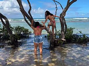 Two beautiful Brazilian women enjoy their first time kissing and exploring on the sunny beach. Their curvy bodies shine under the sun in this outdoor adventure.