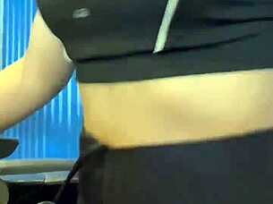 After workout hottie in crowded bathroom enjoys muff diving and cunilingus leading to orgasm and creampie.