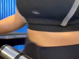 After workout hottie in crowded bathroom enjoys muff diving and cunilingus leading to orgasm and creampie.