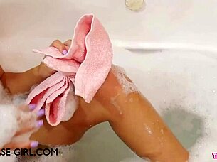 Hey, check out this charming young brunette beauty relaxing in a soothing bath after her day.