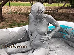 Clay sploshing solo in the pool with tattooed Ciren V