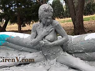Clay sploshing solo in the pool with tattooed Ciren V