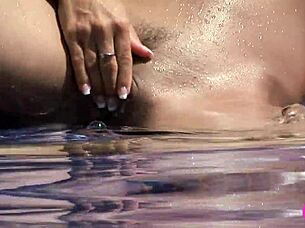 subtle hints of busty beauties exploring each other by the pool with tender licks and touches