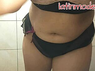 huge tits and big ass latina model posing suggestively in lingerie