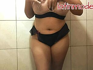 huge tits and big ass latina model posing suggestively in lingerie