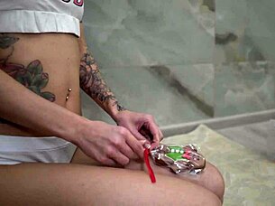 Tattooed cutie sucks lollipop rides dildo to orgasm