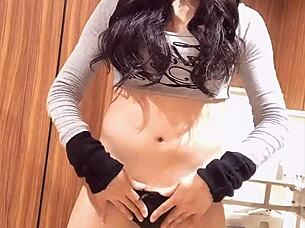 Hey, check out this Japanese shemale with beautiful curves quietly masturbating in a solo session