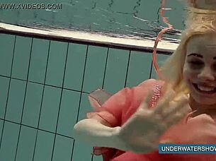 Hey, check out Katya Okuneva in her red dress by the pool