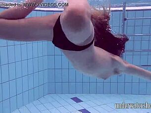 Lucy Removes Bikini While Swimming In Pool