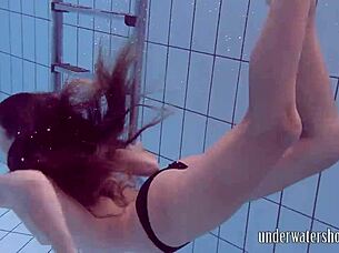 Lucy Removes Bikini While Swimming In Pool