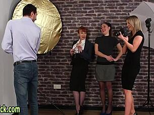 Seasoned domina mocks in CFNM behind the scenes with glasses and handjob.