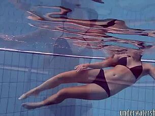 Lucy Removes Bikini While Swimming In Pool