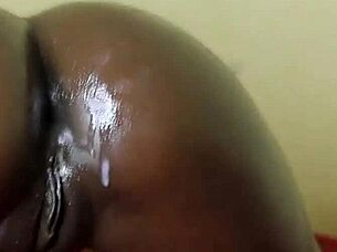 This horny ebony amateur bends over for some intense anal doggystyle action, taking cum deep inside her oiled ass.