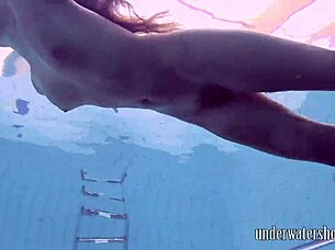 Lucy Removes Bikini While Swimming In Pool