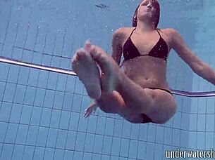 Lucy Removes Bikini While Swimming In Pool