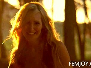 German busty blonde teen 18+ corinna poses at sunset in outdoor softcore scene.