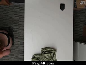 The loss prevention officer caught the young shoplifter stealing items and handled the situation firmly in the backroom.