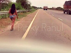 pinky takes on a bold naked dare flashing across busy indian highways in outdoor adventure