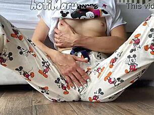 This skinny teen 18+ in pajamas shows off small tits while masturbating close up to a squirting orgasm.