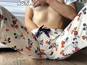 This skinny teen 18+ in pajamas shows off small tits while masturbating close up to a squirting orgasm.