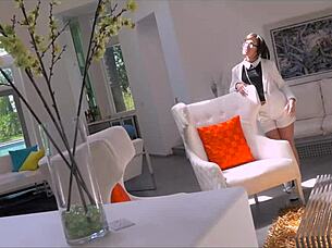 Beautiful brunette girl masturbates shaved pussy with anal finger on bed in detailed scene