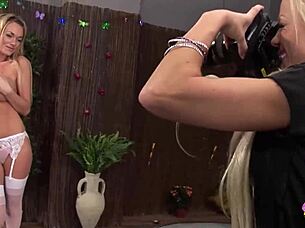 Busty blonde lesbians Cindy Behr and Paige Ashley share dildos after photoshoot